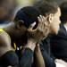 A Virginia Commonwealth player buries his head in his hands in the final minute of play in the game against Michigan on Saturday, March 23. Michigan won 78-53. Daniel Brenner I AnnArbor.com